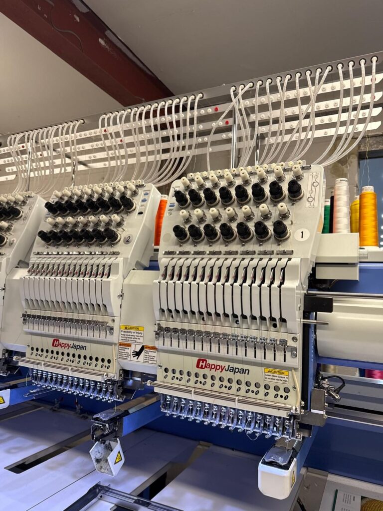 Embroidery machines running festival merchandise