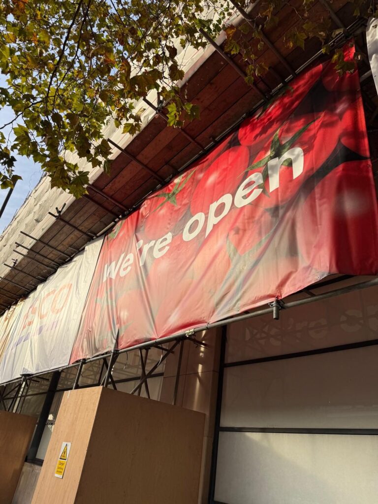 Tesco We're open scaffold banner