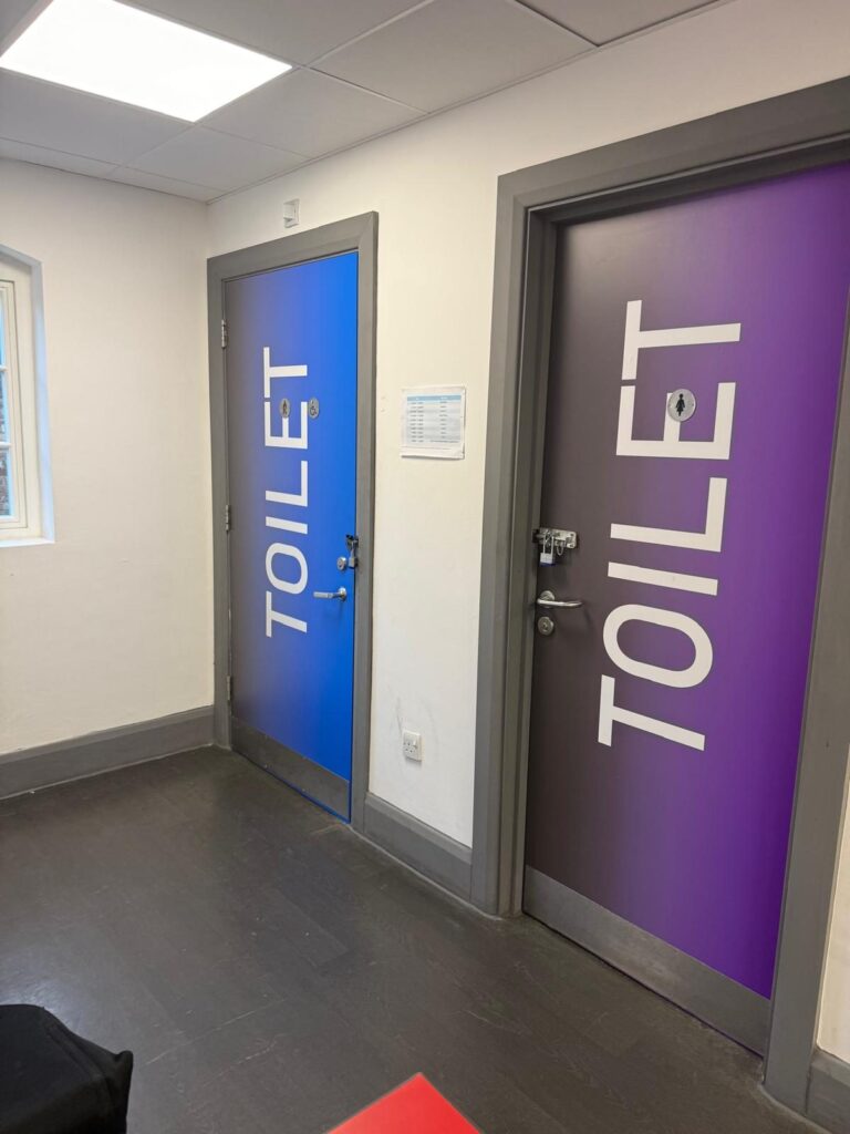 Toilet door wraps in the school corridor