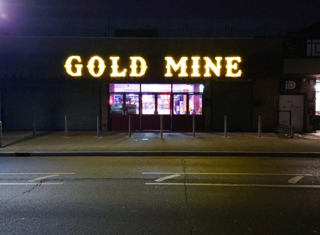 Illuminated built-up letters for Gold Mine arcade, Southend seafront, lit at night, by Flash Design & Print